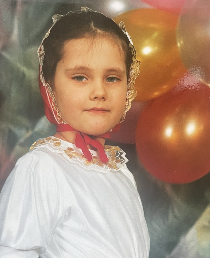 Natalia as a kid at a birthday party