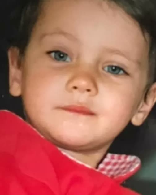 Natalia as a toddler in a red jacket